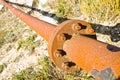 Old rusty pipeline with flange and bolts Royalty Free Stock Photo