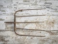 Old Rusty Pitchfork Head on a Barn Wall Royalty Free Stock Photo
