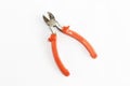 Old rusty pliers tools, metal cutting pliers with orange handle