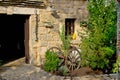 Old rusty plough in stone street