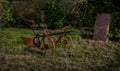 Old rusty plow at a field Royalty Free Stock Photo