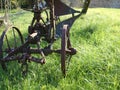 Old rusty plow in the landscape Royalty Free Stock Photo