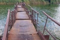 Old, rusty pontoon-bridge over small river Sura to remote Ukrainian village Royalty Free Stock Photo