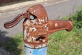 Old rusty pump well on the street Royalty Free Stock Photo