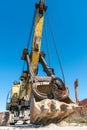 an old rusty quarry excavator is located on the territory of a mining quarry. an open method of mining