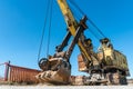 an old rusty quarry excavator is located on the territory of a mining quarry. an open method of mining