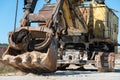 an old rusty quarry excavator is located on the territory of a mining quarry. an open method of mining