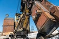 an old rusty quarry excavator is located on the territory of a mining quarry. an open method of mining