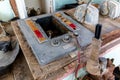 Old, rusty radio communication intercom device at the bridge of a cargo ship run aground