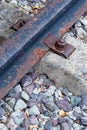 Old and rusty rail part railway track close-up on a gravel background Royalty Free Stock Photo