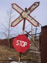 Old and rusty railroad sign with stop letters Royalty Free Stock Photo