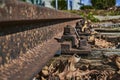 an old and rusty railroad track with a weathered railroad tie and metal bolts Royalty Free Stock Photo