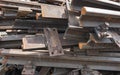 Old rusty railroad tracks for scrapping in a warehouse space