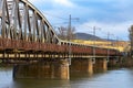 old rusty railway bridge over the river Royalty Free Stock Photo