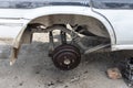 Old rusty rear brake rotor and wheel hub assembly