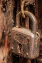 Old rusty but reliable barn door lock Royalty Free Stock Photo