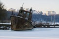 Old rusty rescue boat froze in the ice Royalty Free Stock Photo