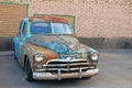 Old rusty retro car parked near a brick wall Royalty Free Stock Photo