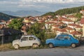 Old rusty retro cars on the street of old Balkan town Royalty Free Stock Photo