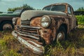 Old rusty retro vintage car with peeling paint close up, abandoned auto Royalty Free Stock Photo