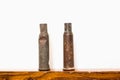 Old rusty rifle cartridges from the second world war on a white background. Royalty Free Stock Photo