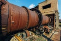 Old rusty rotating kiln in cement manufacturing plant Royalty Free Stock Photo