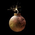 Old rusty round iron bomb ignited and sparkling isolated on black background