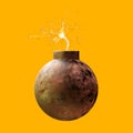 Old rusty round iron bomb ignited and sparkling isolated on yellow background