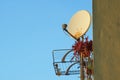 Old rusty satellite antenna on the wall Royalty Free Stock Photo