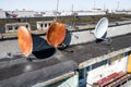 Old rusty satellite dishes on the roof Royalty Free Stock Photo