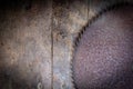 Old rusty saw blades on a wooden table Royalty Free Stock Photo