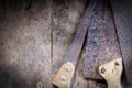 Old rusty saw blades on a wooden table Royalty Free Stock Photo