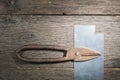 Old rusty scissors on metal on gray planks a background. Royalty Free Stock Photo