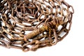 Old rusty screw lies on an old rusty chain. Royalty Free Stock Photo
