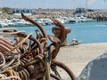 Old rusty ship anchors abandoned on the ground in port Royalty Free Stock Photo