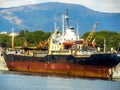 An old rusty ship embarked aground near the black sea shore Royalty Free Stock Photo