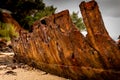 An Old Rusty Shipwreck Wastes Away