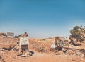 Old rusty signs with the end of the world coffee shop and best view at the end of Ed Deir trail, in Petra Jordan