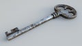 Old rusty skeleton key on a grey surface. Vintage security and mystery concept Royalty Free Stock Photo