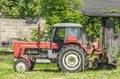 Old rusty small red tractor Ursus C360 staying