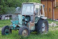 Old rusty soviet-made tractor in the farmyard Royalty Free Stock Photo