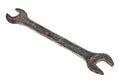 Old rusty spanner on bright background Royalty Free Stock Photo