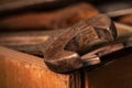 Old rusty spanners in a wooden box. Old rusty tools closeup