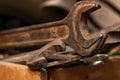 Old rusty spanners in a wooden box. Old rusty tools closeup