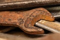Old rusty spanners in a wooden box. Old rusty tools closeup Royalty Free Stock Photo