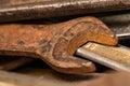 Old rusty spanners in a wooden box. Old rusty tools closeup