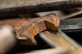 Old rusty spanners in a wooden box. Old rusty tools closeup