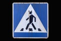 Old road sign `Pedestrian crossing` isolated on black. Royalty Free Stock Photo