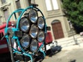 Old rusty stage spotlights at stage.Vintage bid studio light reflector equipment in a stand for cinema, movies and photography