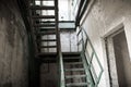 Old rusty staircase in a ruined building Royalty Free Stock Photo